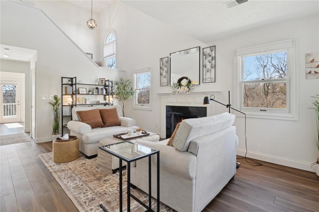 412 Chandler Place Pittsburgh, PA 15212 - Photo 5 of 38 a living room with furniture and a fireplace