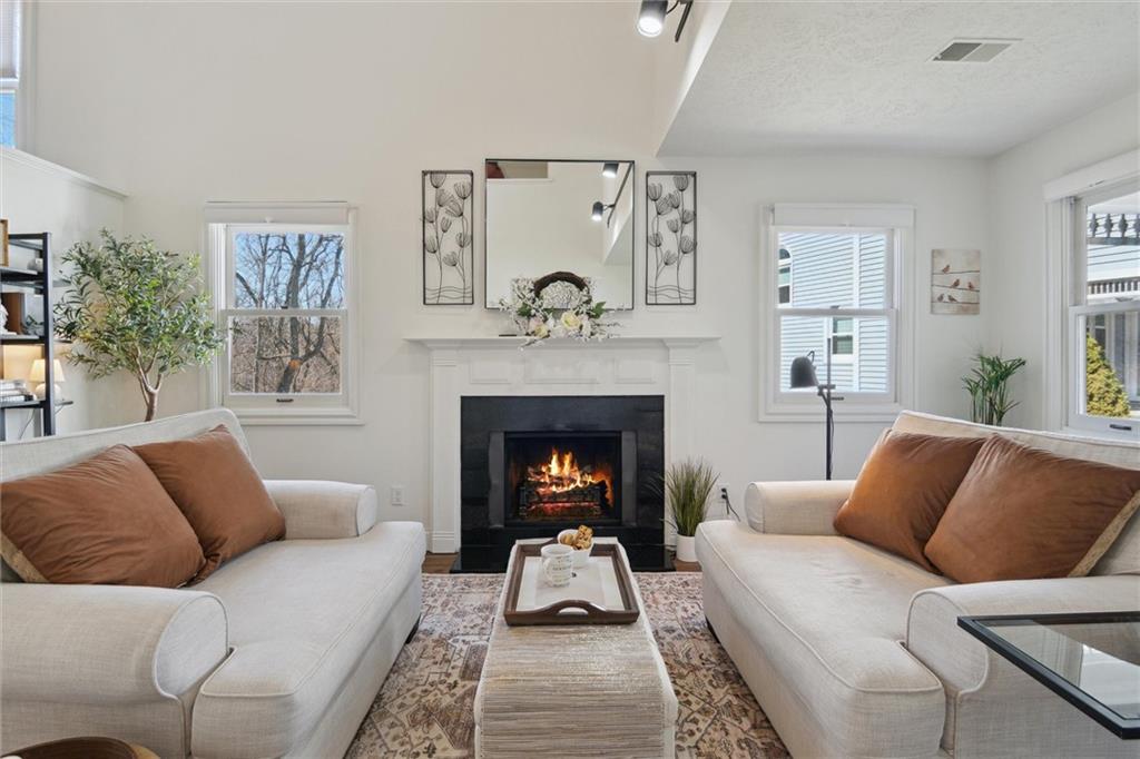 412 Chandler Place Pittsburgh, PA 15212 - Photo 6 of 38 a living room with furniture and a fireplace