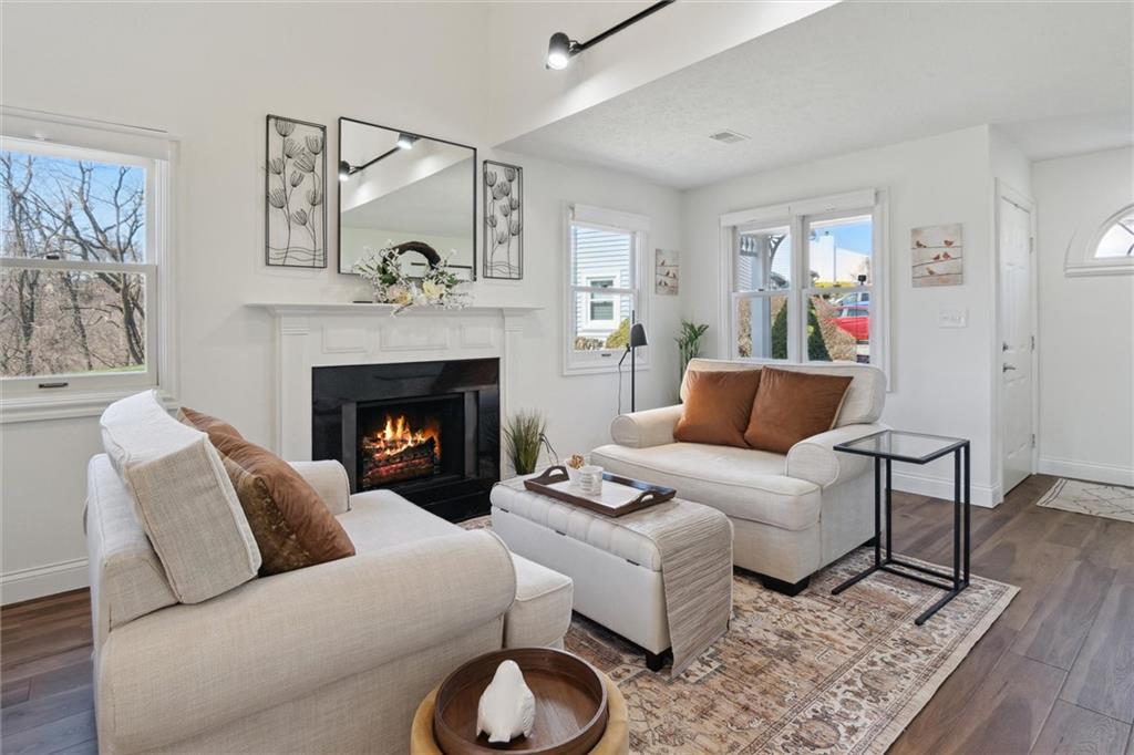 412 Chandler Place Pittsburgh, PA 15212 - Photo 7 of 38 a living room with furniture and a fireplace