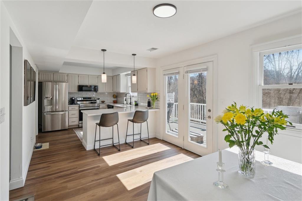 412 Chandler Place Pittsburgh, PA 15212 - Photo 9 of 38 a kitchen with white cabinets and stainless steel appliances