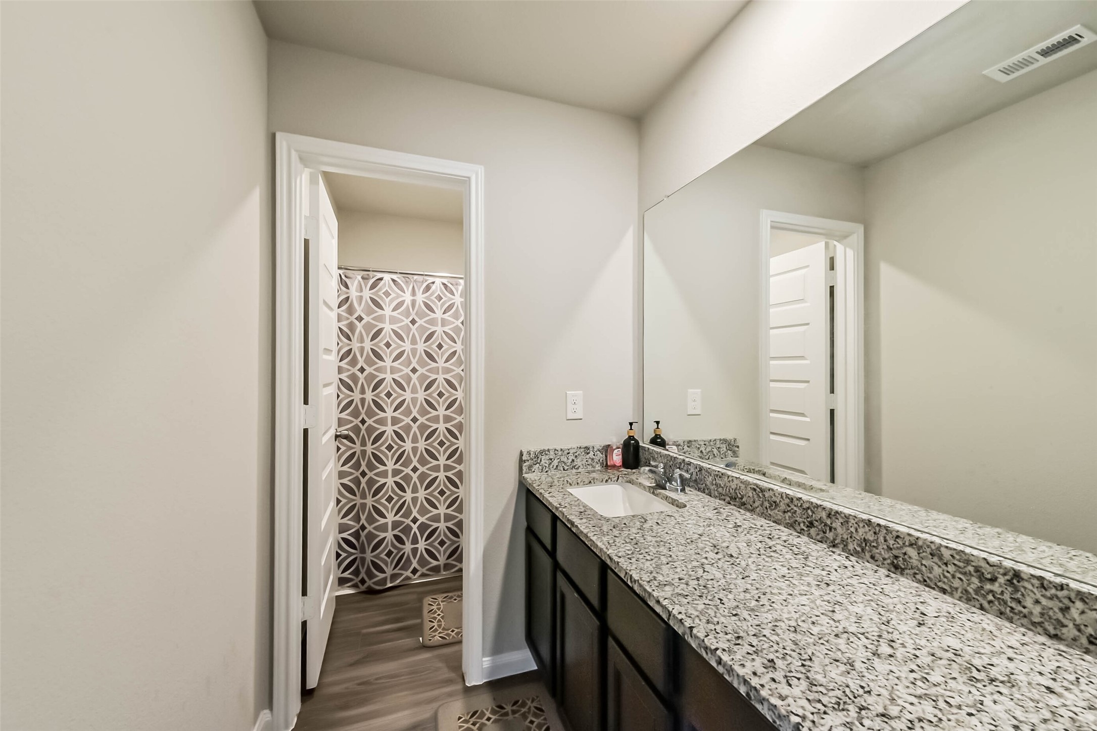 4907 Luke Matthew Drive Rosharon, TX 77583 - Photo 33 of 42 a bathroom with a granite countertop sink and a mirror