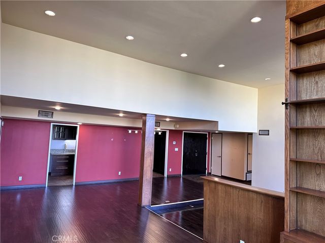 a kitchen with stainless steel appliances granite countertop a refrigerator and a stove