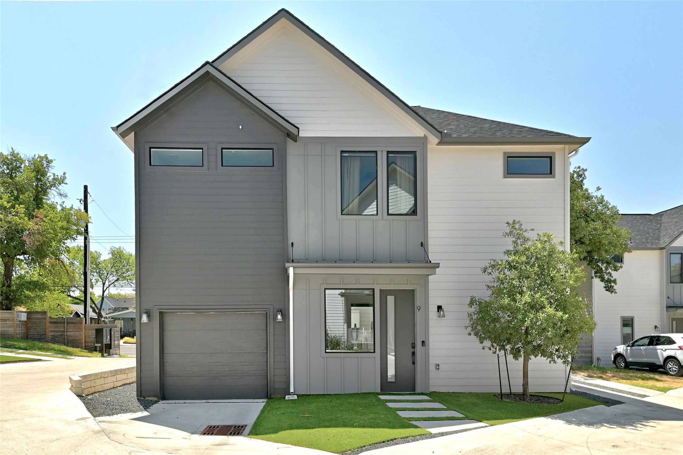 1140 Webberville Road, Unit 9 Austin, TX 78721 - Photo 2 of 13 Modern facade with a blend of siding and large windows offers contemporary curb appeal.