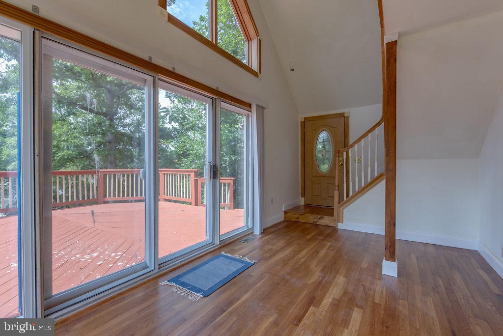 740 Powhatan Beach Road Pasadena, MD 21122 - Photo 12 of 39 Sunroom onto deck & open to living room