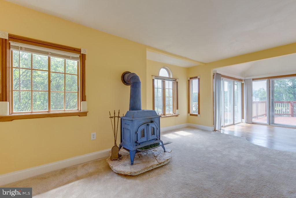 740 Powhatan Beach Road Pasadena, MD 21122 - Photo 25 of 39 Wood burninig stove in the living room