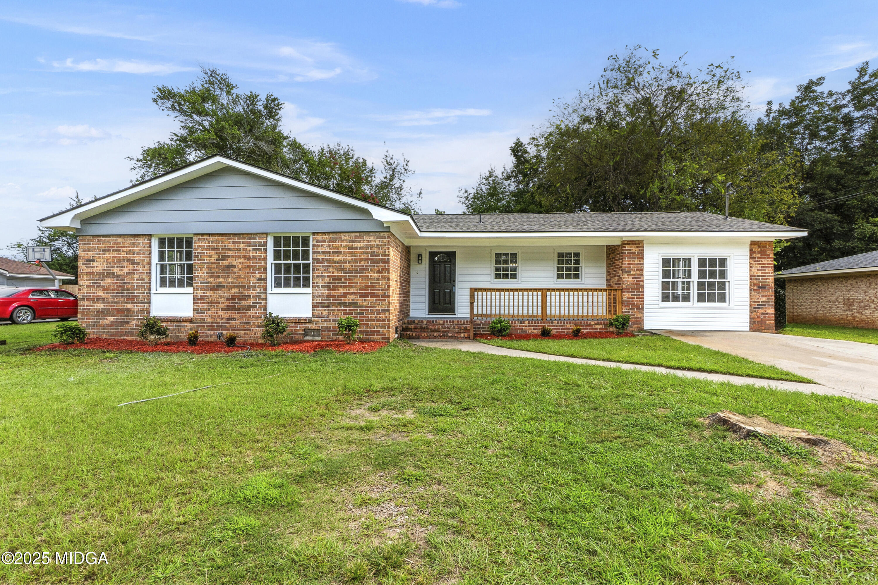 a front view of house with yard and green space