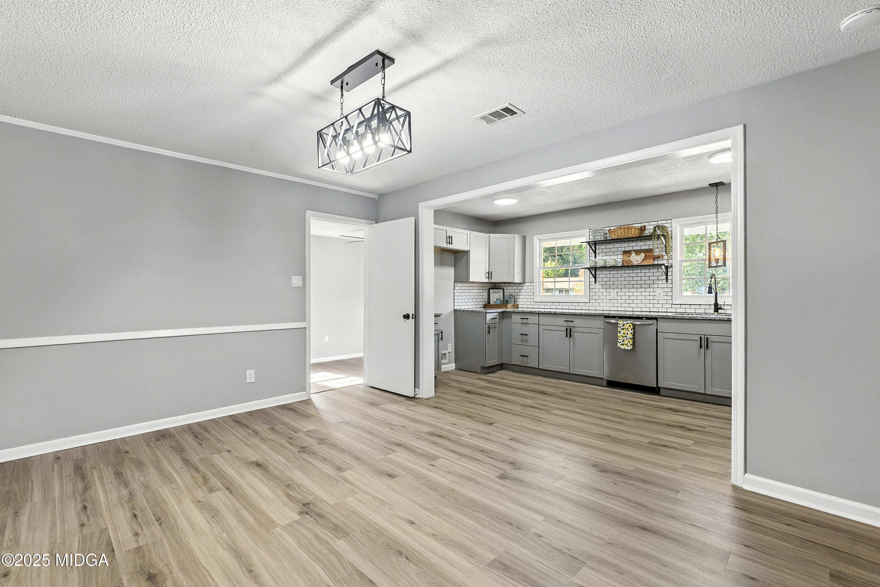 109 Scarborough Road Centerville, GA 31028 - Photo 11 of 52 a view of a kitchen with a sink wooden floor and a kitchen