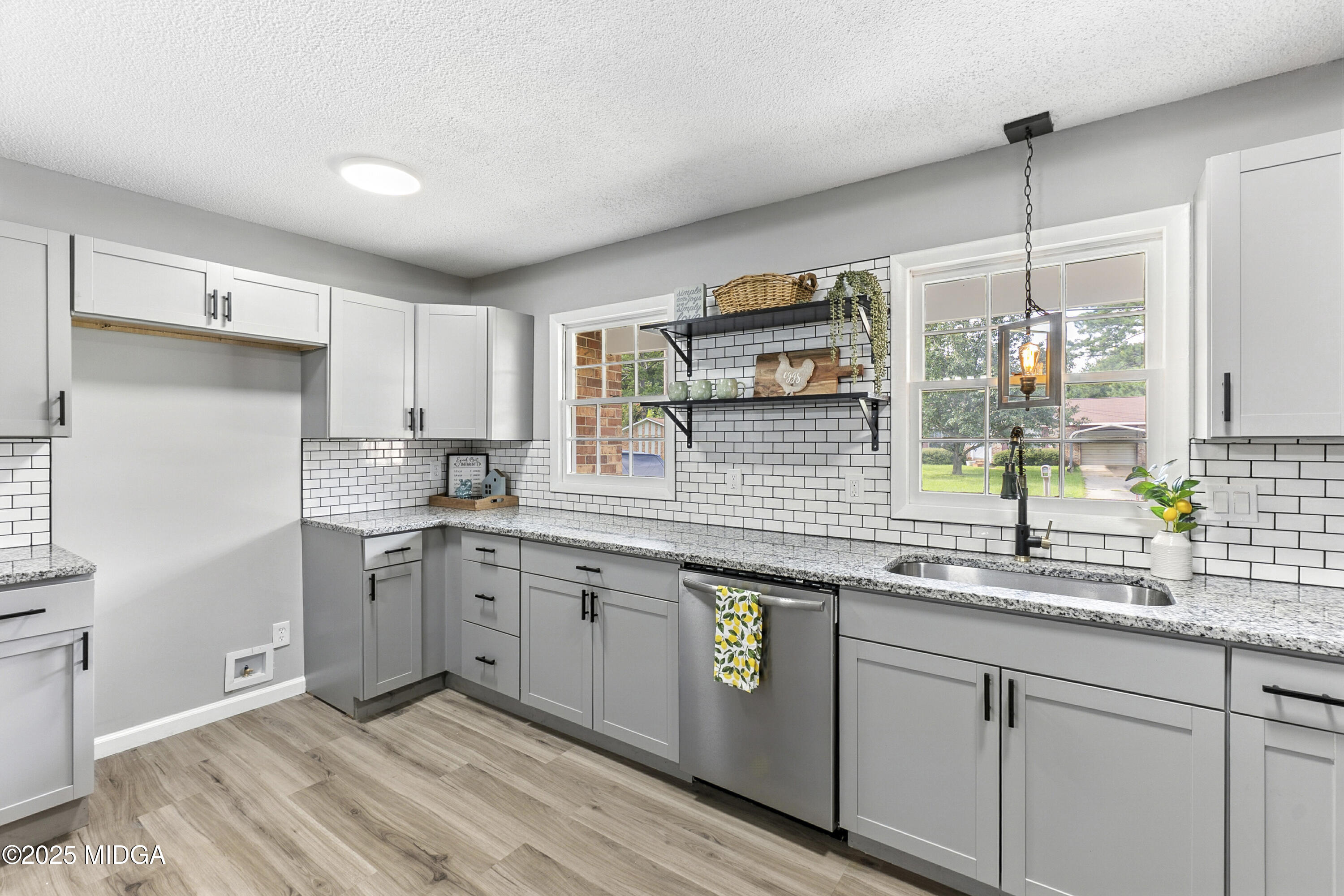 109 Scarborough Road Centerville, GA 31028 - Photo 14 of 52 a kitchen with a sink cabinets and window