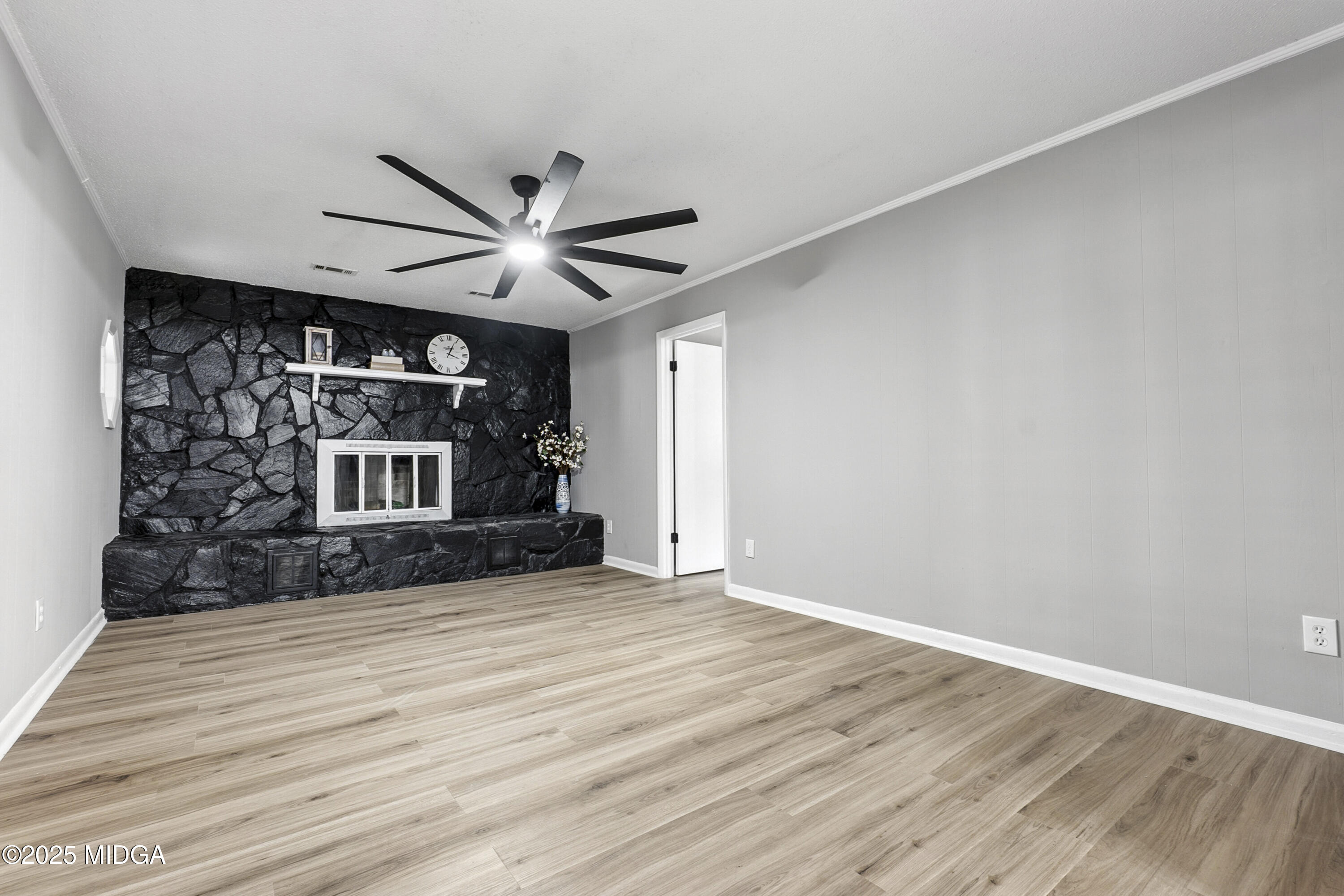 109 Scarborough Road Centerville, GA 31028 - Photo 17 of 52 a view of a livingroom with a fireplace and a ceiling fan