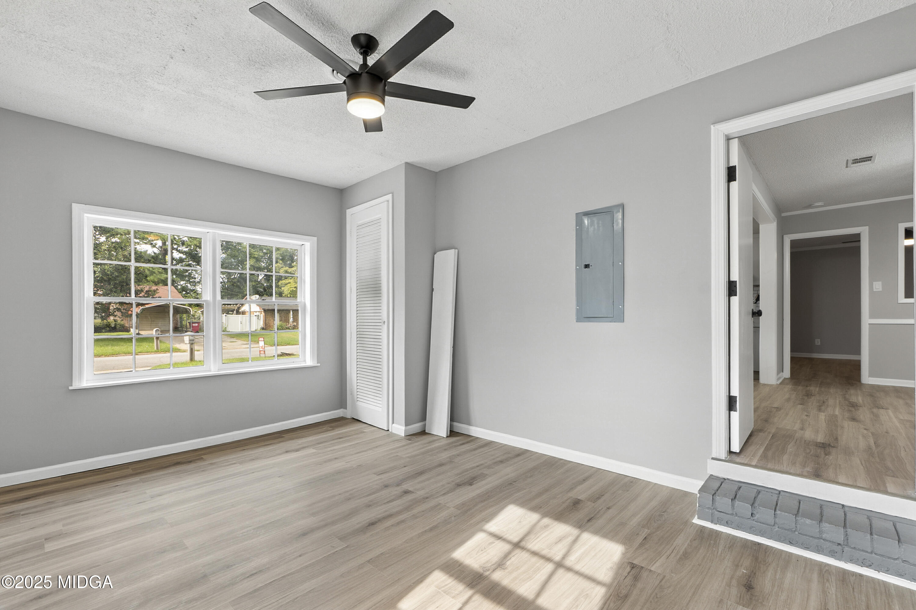 109 Scarborough Road Centerville, GA 31028 - Photo 20 of 52 a view of an empty room and window and a ceiling fan
