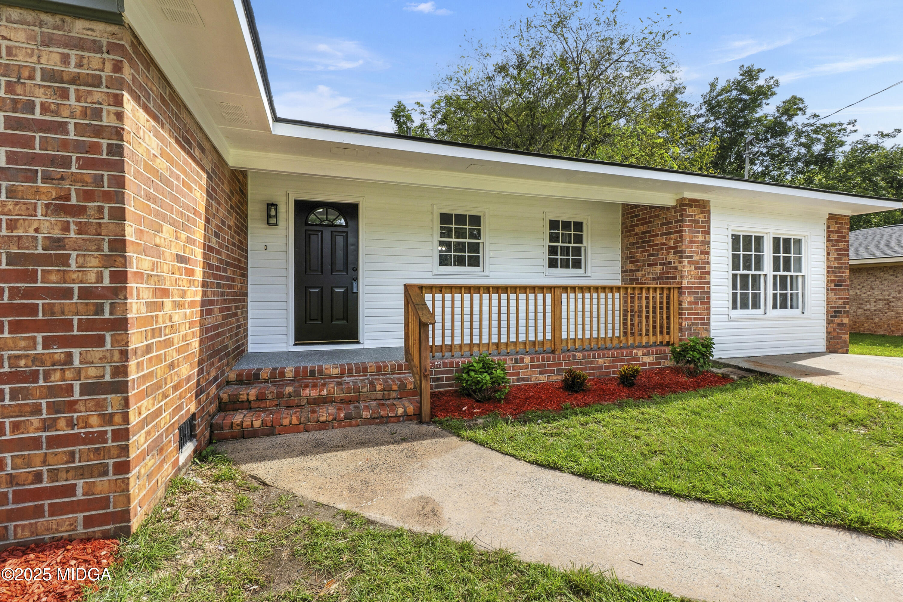 109 Scarborough Road Centerville, GA 31028 - Photo 2 of 52 a front view of a house with a garden and yard