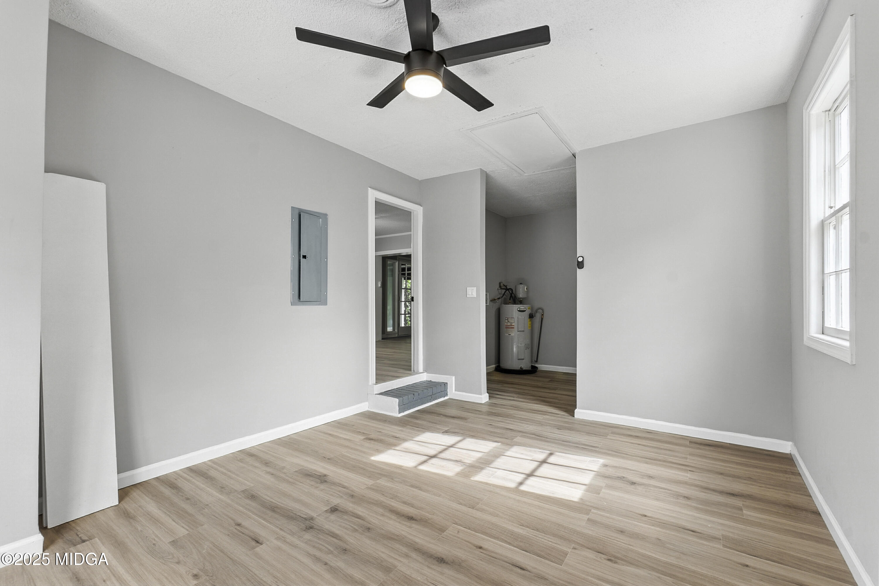 109 Scarborough Road Centerville, GA 31028 - Photo 21 of 52 a view of empty room with wooden floor and fan