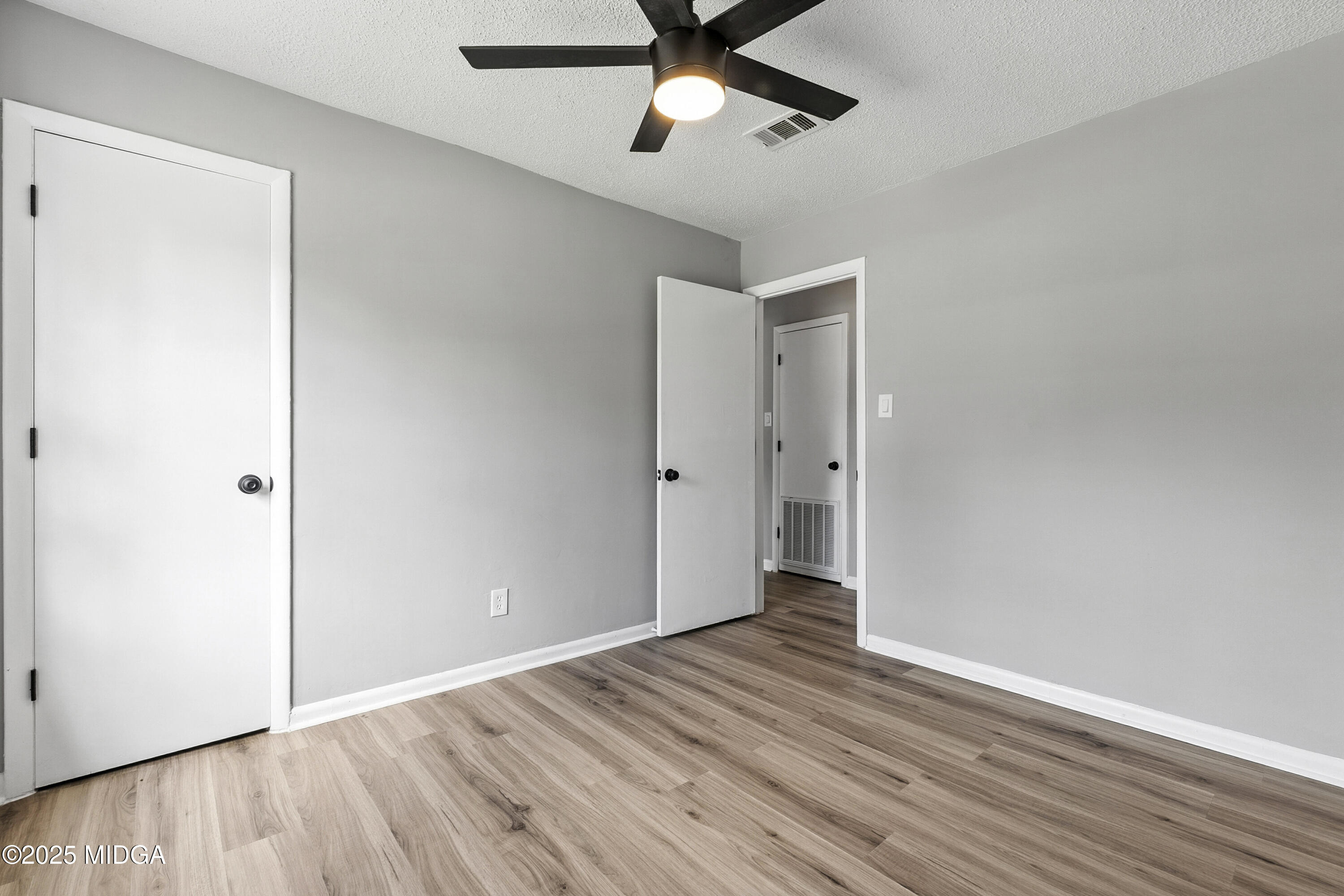109 Scarborough Road Centerville, GA 31028 - Photo 24 of 52 a view of empty room with wooden floor