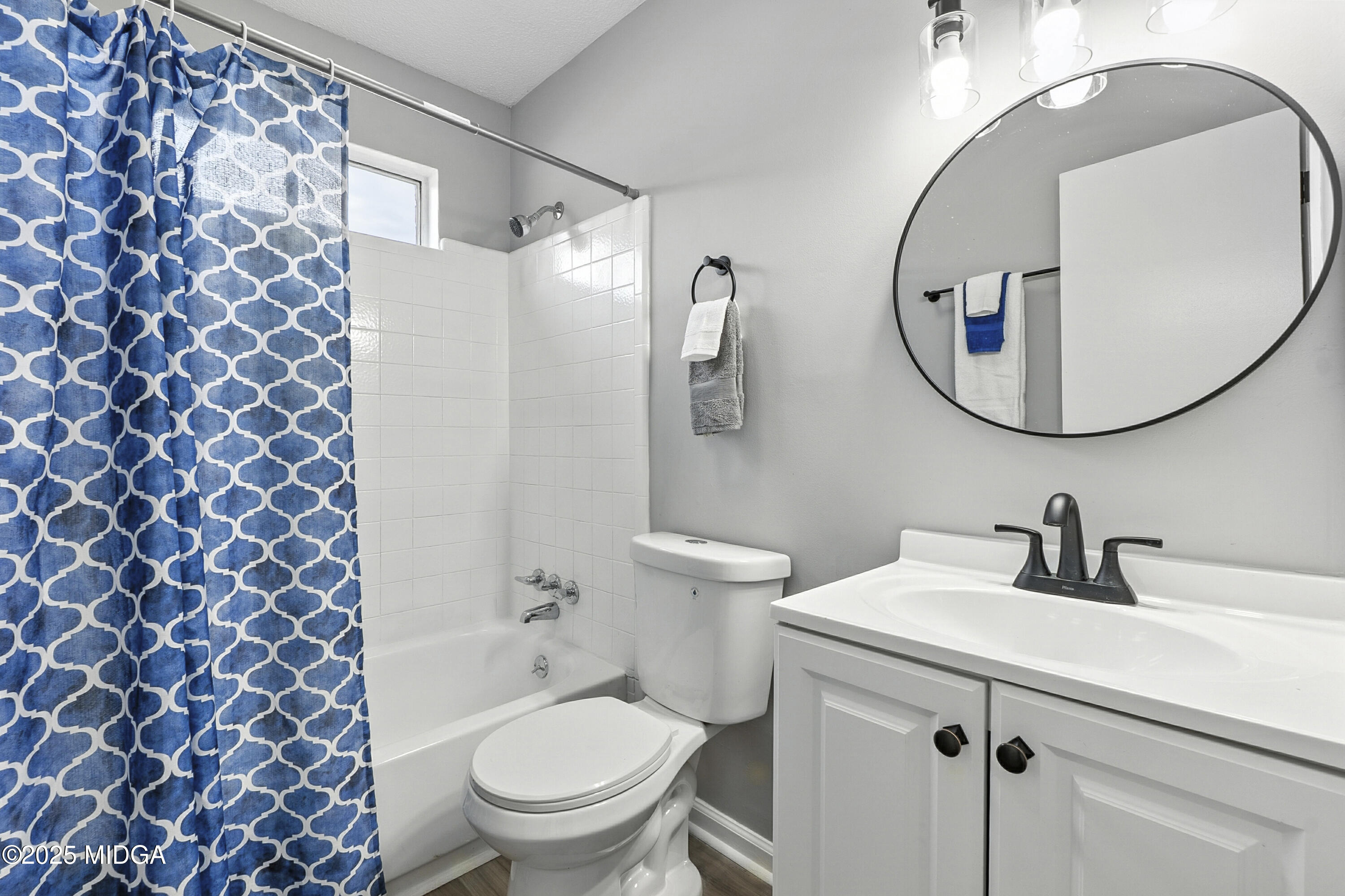 109 Scarborough Road Centerville, GA 31028 - Photo 25 of 52 a bathroom with a sink toilet and a mirror