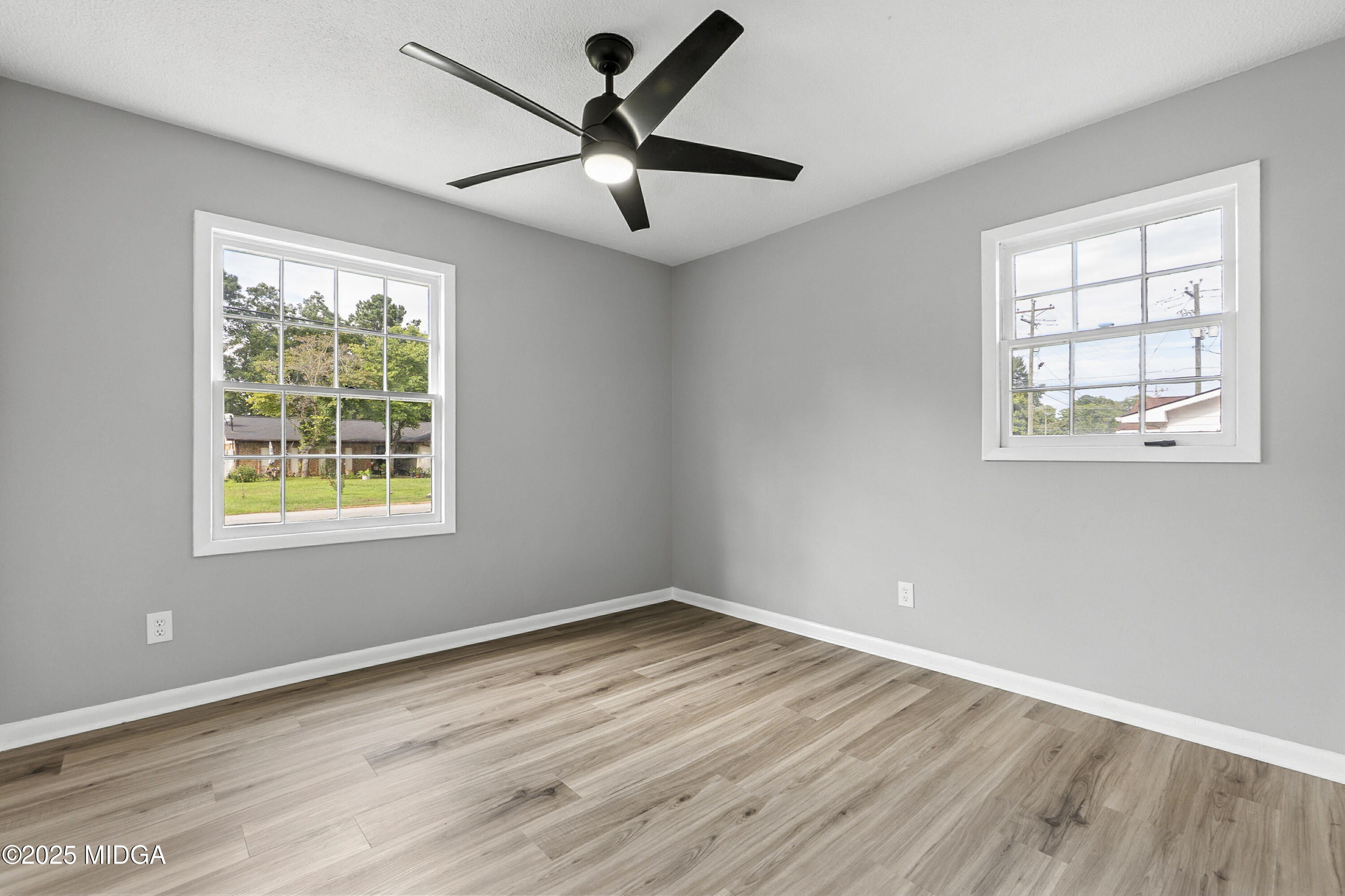 109 Scarborough Road Centerville, GA 31028 - Photo 26 of 52 a view of an empty room with wooden floor and a window