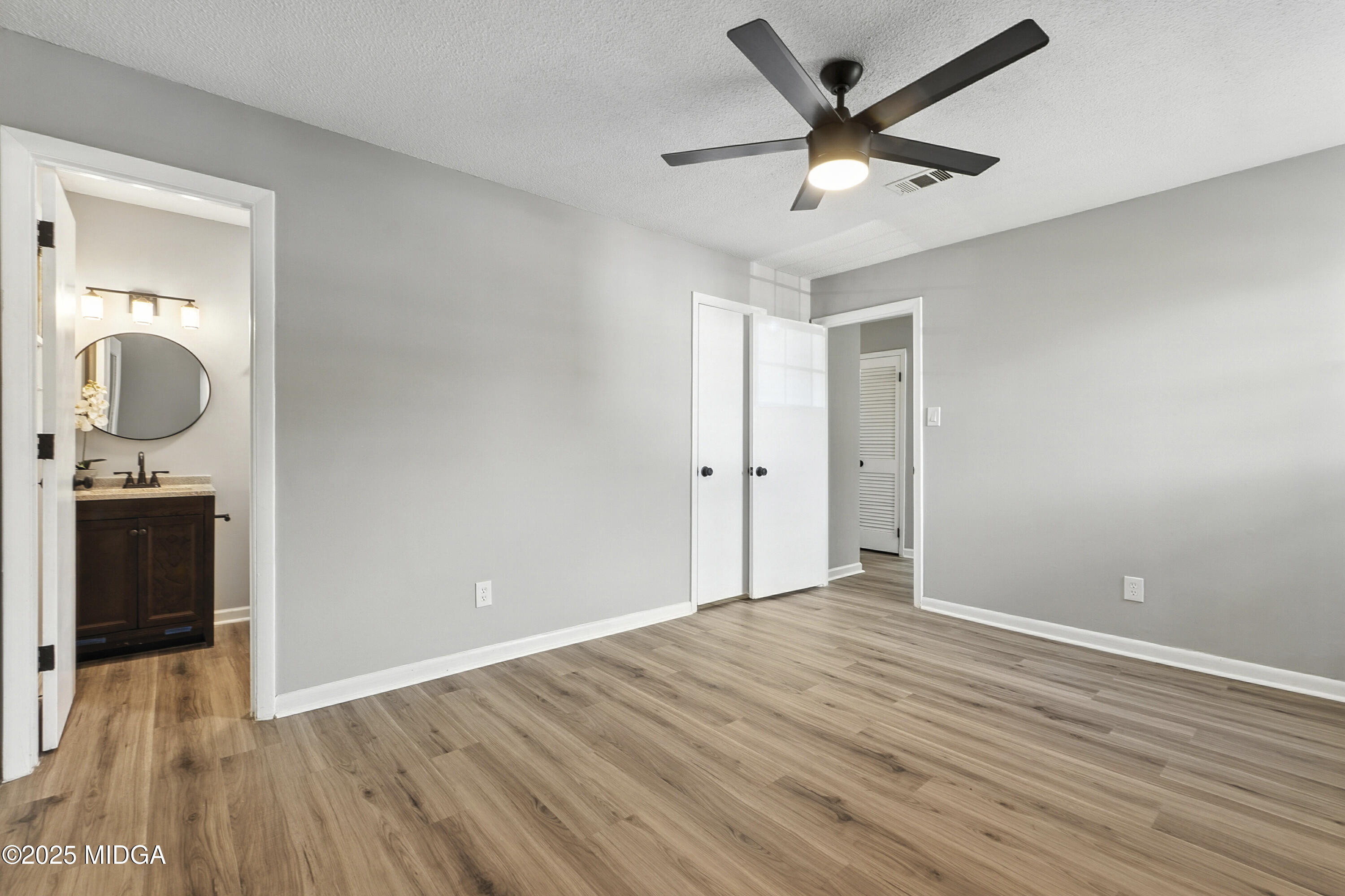 109 Scarborough Road Centerville, GA 31028 - Photo 28 of 52 wooden floor in an empty room with a window