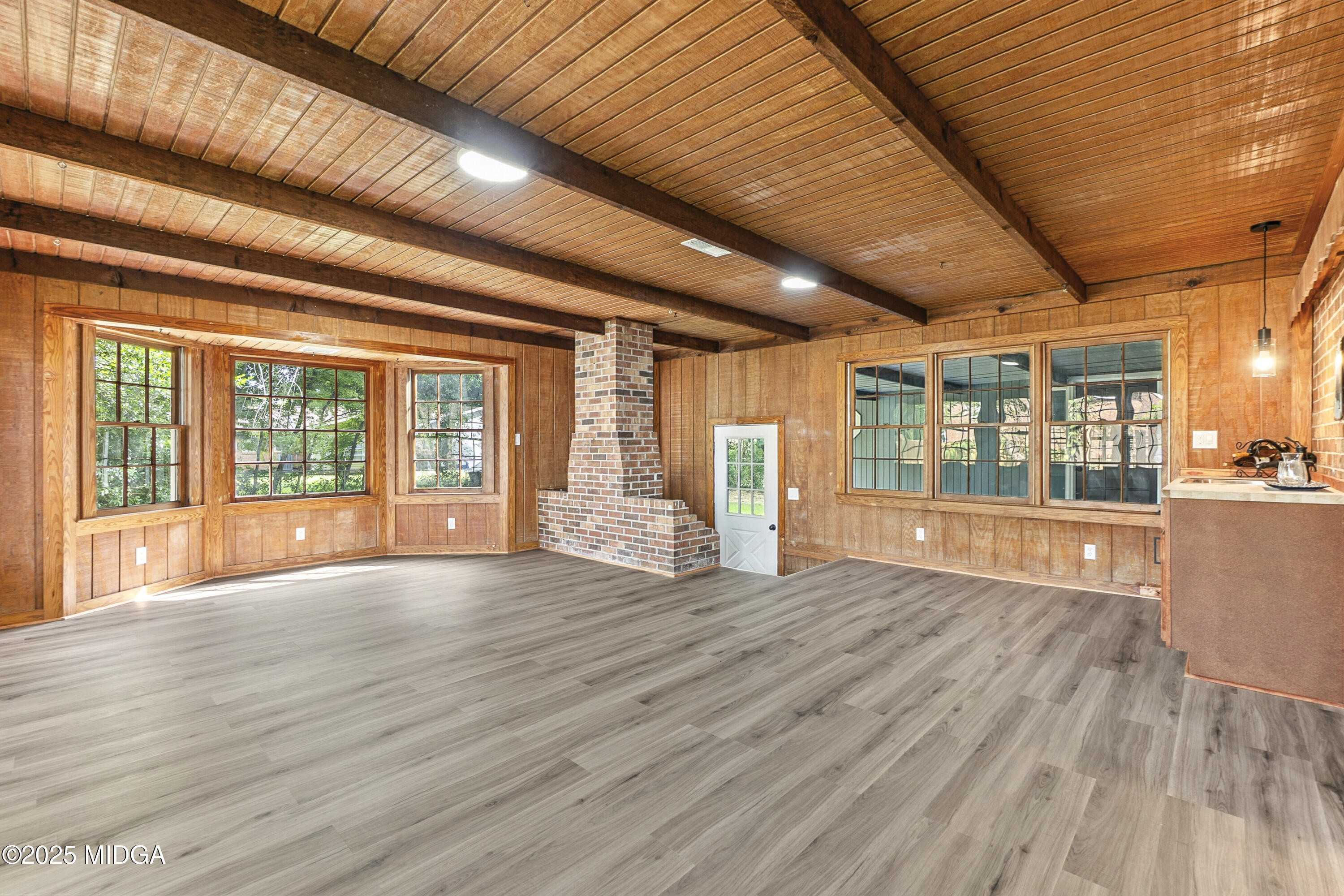 109 Scarborough Road Centerville, GA 31028 - Photo 32 of 52 a view of an empty room with wooden floor and a window
