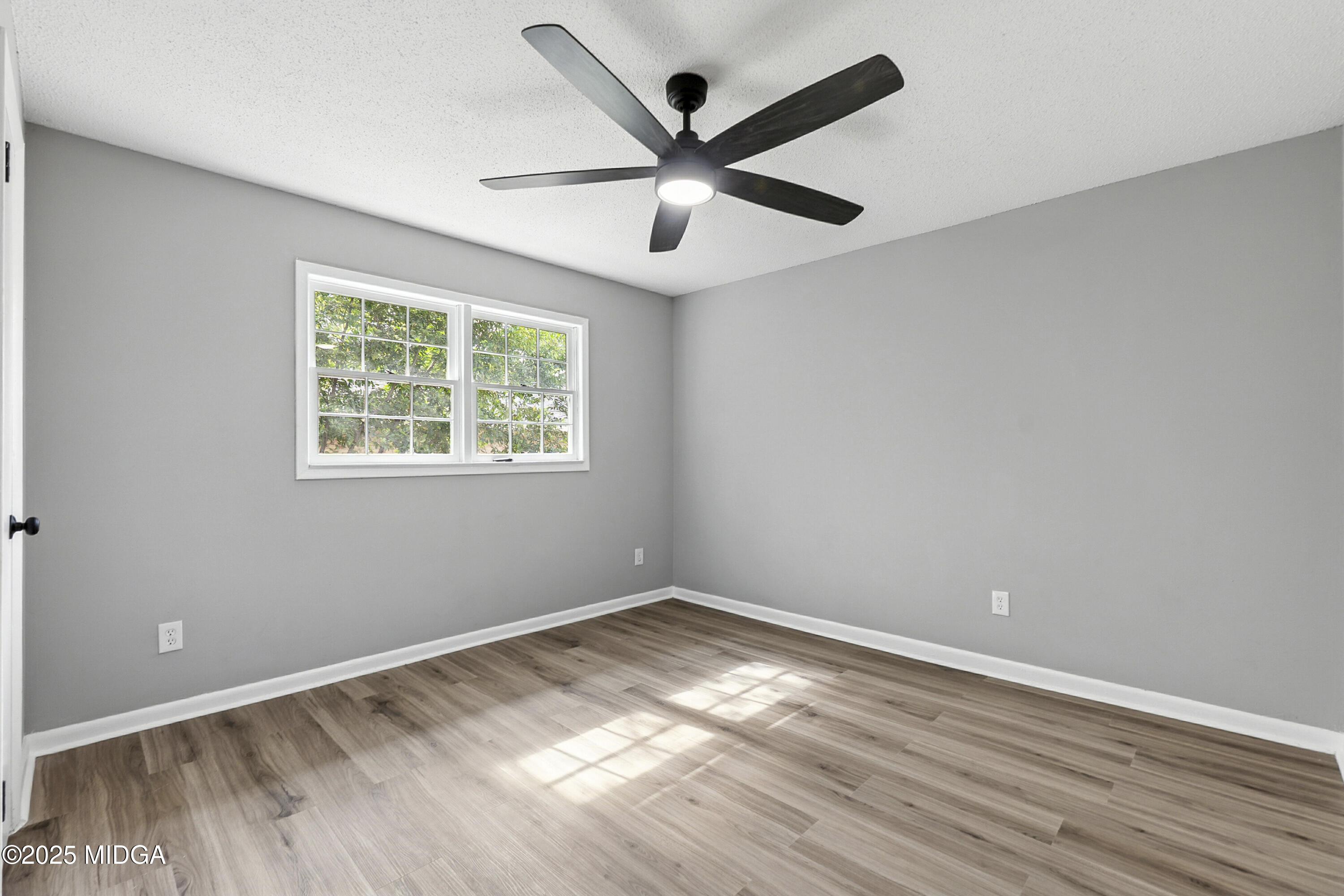 109 Scarborough Road Centerville, GA 31028 - Photo 37 of 52 a view of empty room with wooden floor