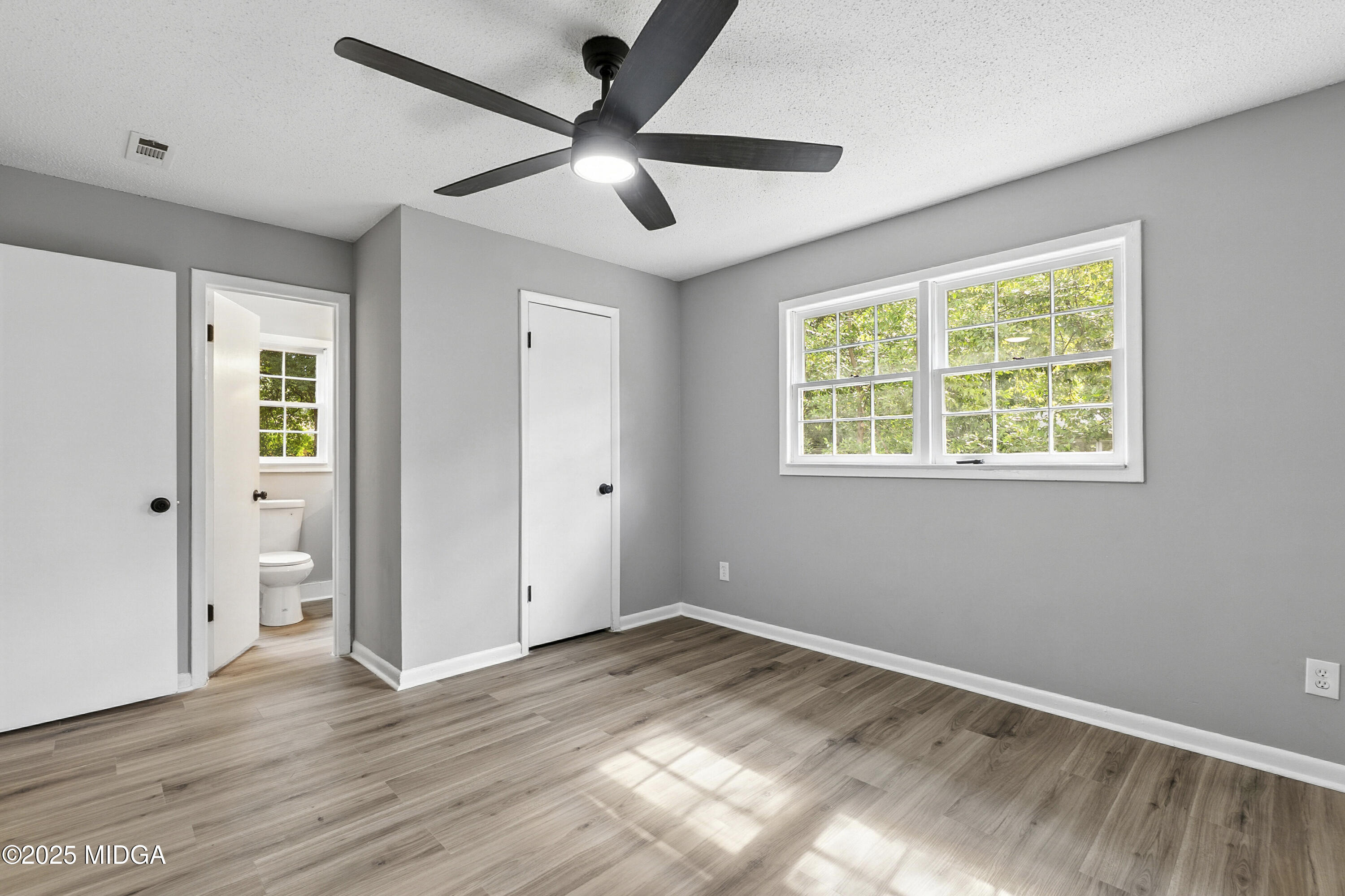 109 Scarborough Road Centerville, GA 31028 - Photo 38 of 52 a view of an empty room with wooden floor and a window