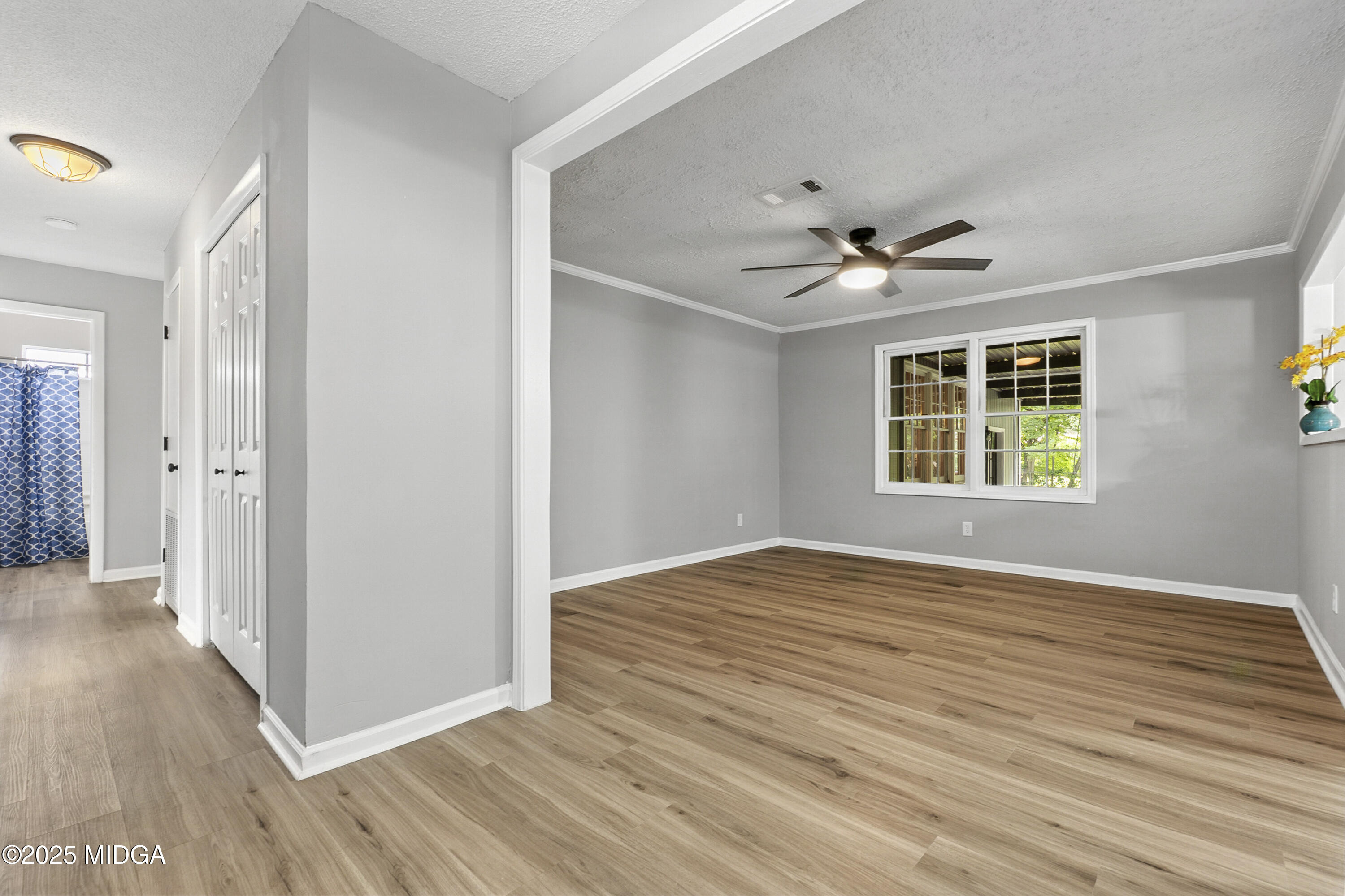 109 Scarborough Road Centerville, GA 31028 - Photo 4 of 52 wooden floor in an empty room with a window