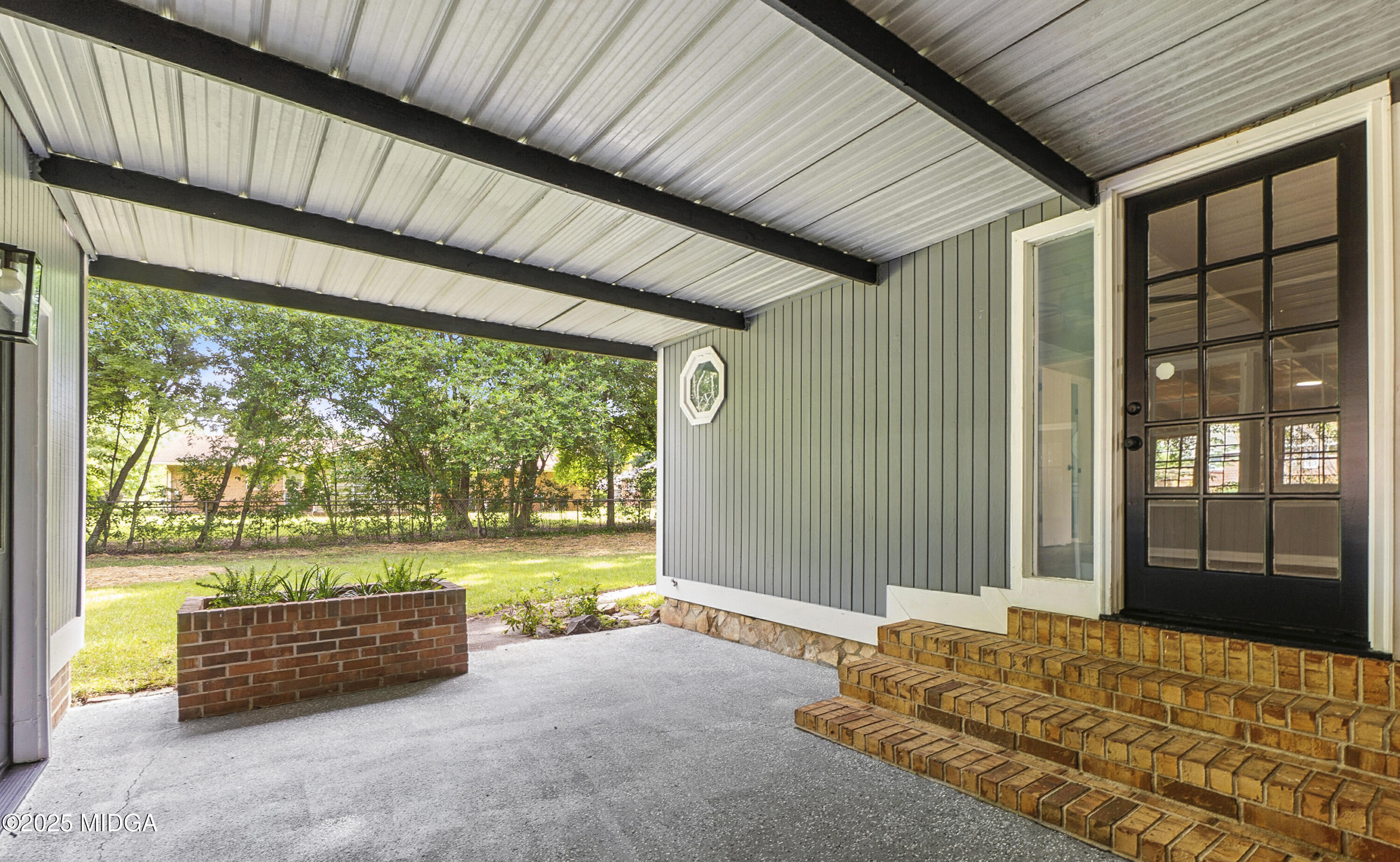 109 Scarborough Road Centerville, GA 31028 - Photo 41 of 52 a bedroom with furniture and large windows