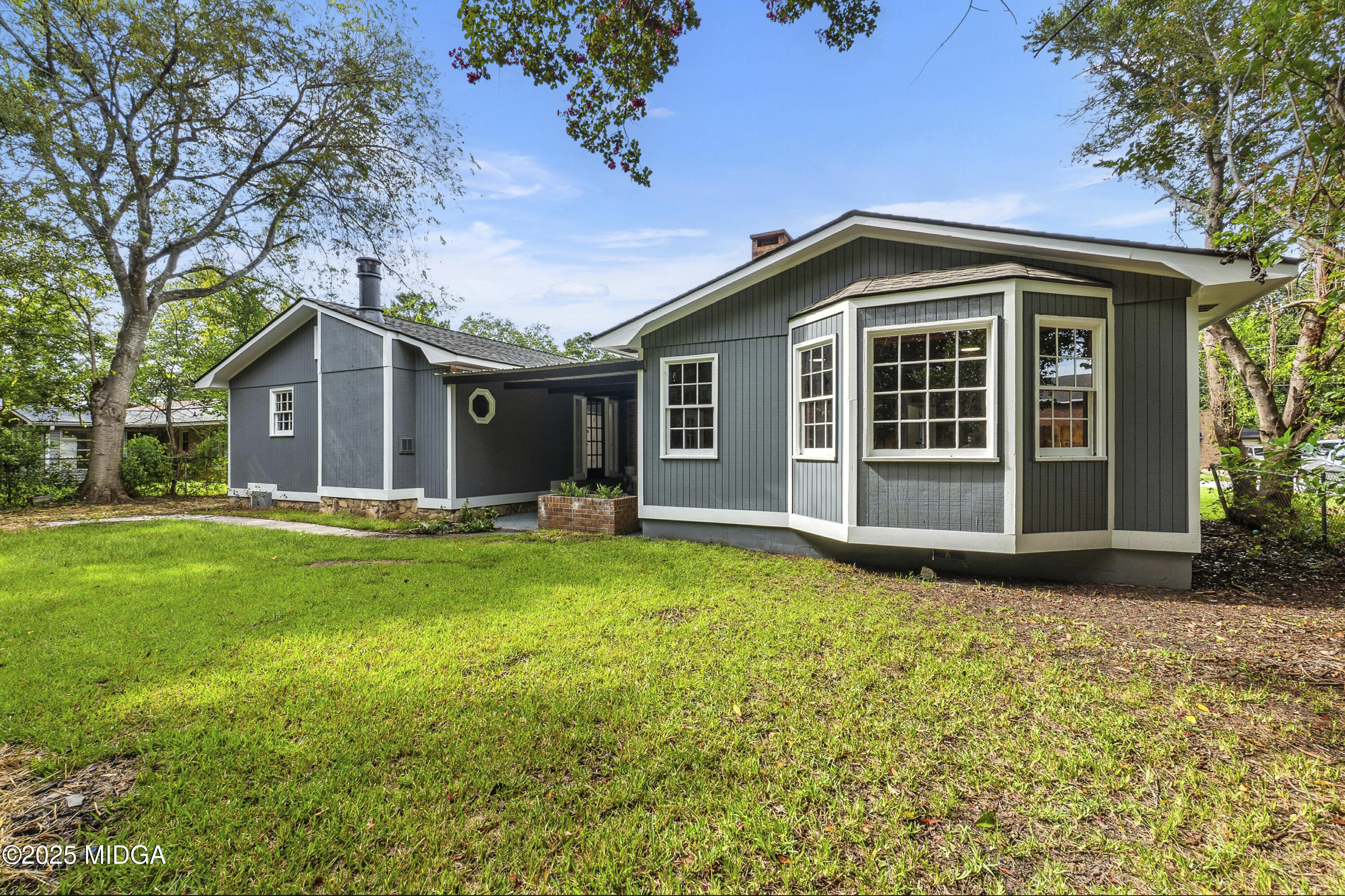 109 Scarborough Road Centerville, GA 31028 - Photo 45 of 52 a front view of a house with a garden