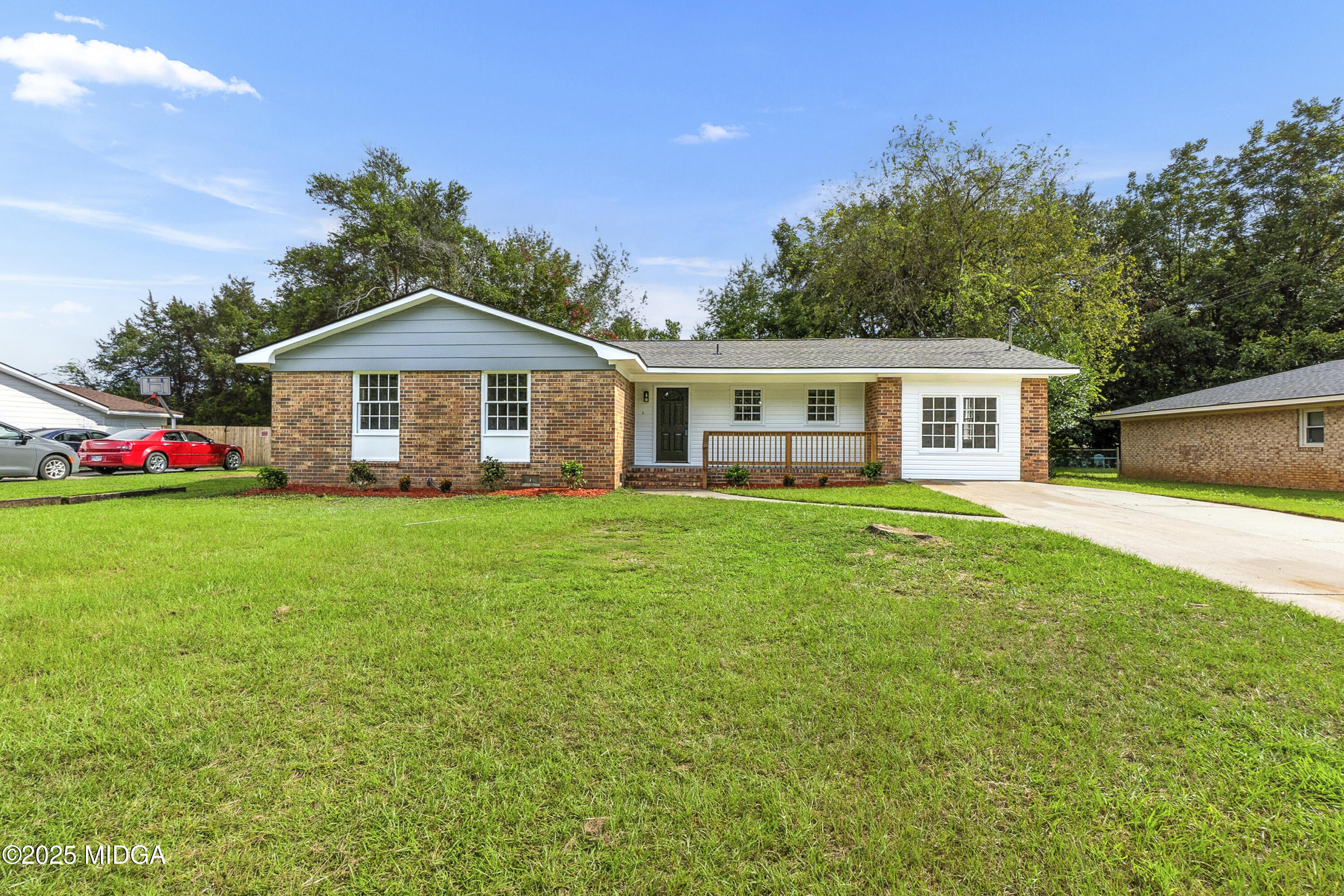 109 Scarborough Road Centerville, GA 31028 - Photo 48 of 52 a front view of a house with a yard and trees