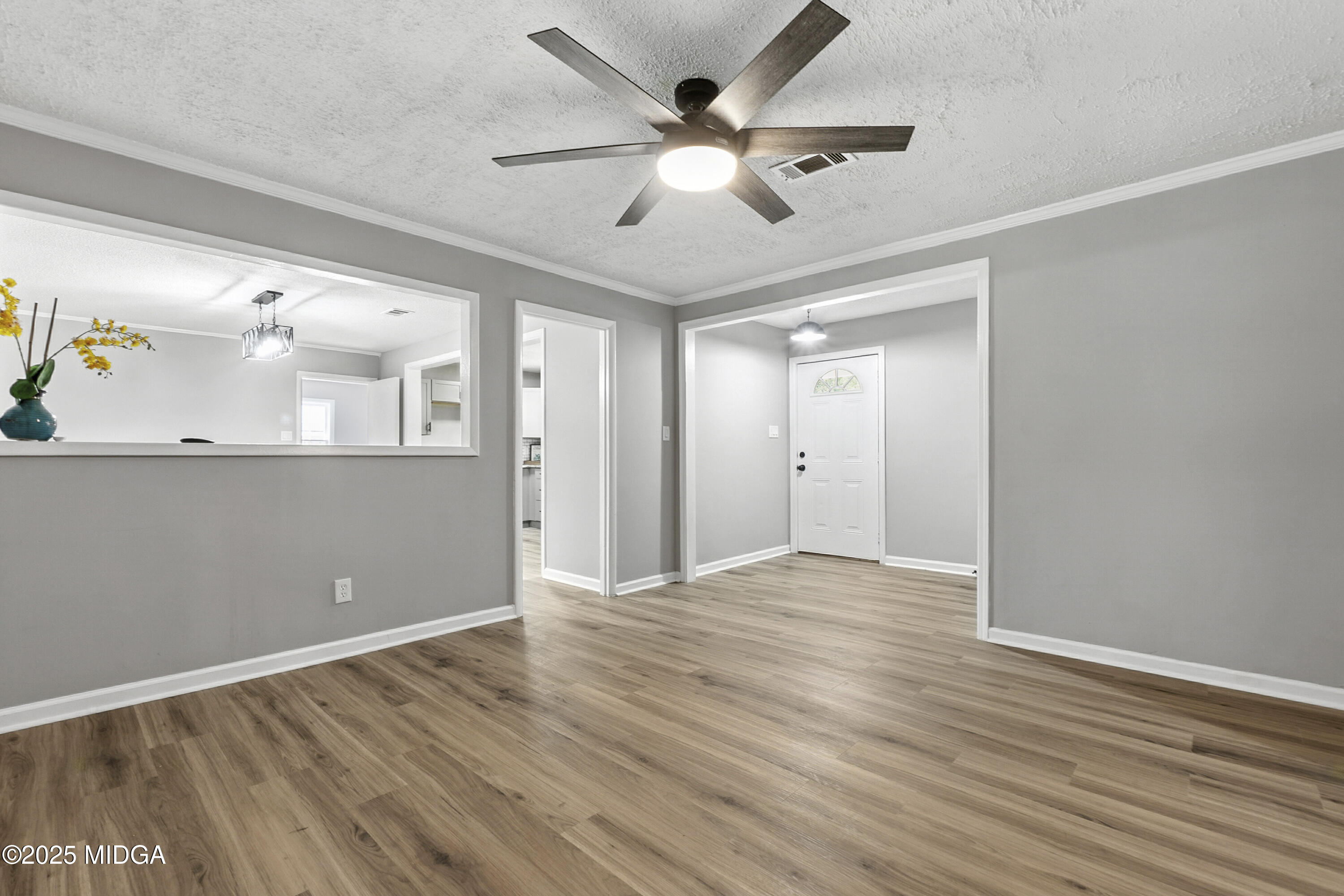 109 Scarborough Road Centerville, GA 31028 - Photo 7 of 52 an empty room with wooden floor and windows