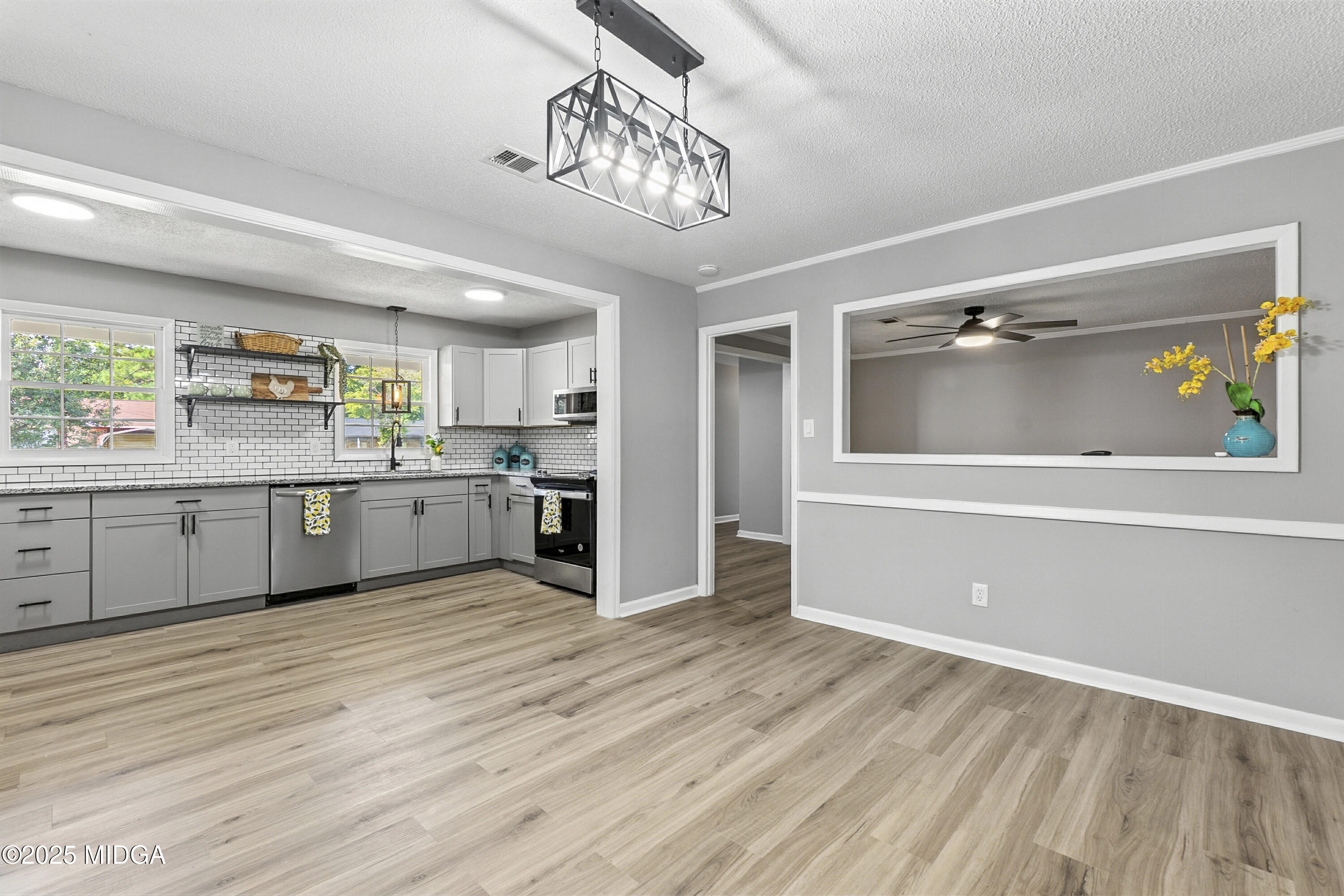 109 Scarborough Road Centerville, GA 31028 - Photo 10 of 52 a large kitchen with stainless steel appliances granite countertop a stove and cabinets