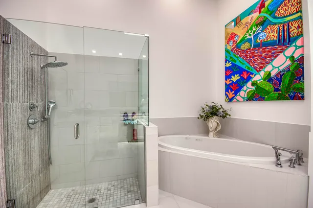 a white bath tub with a shower