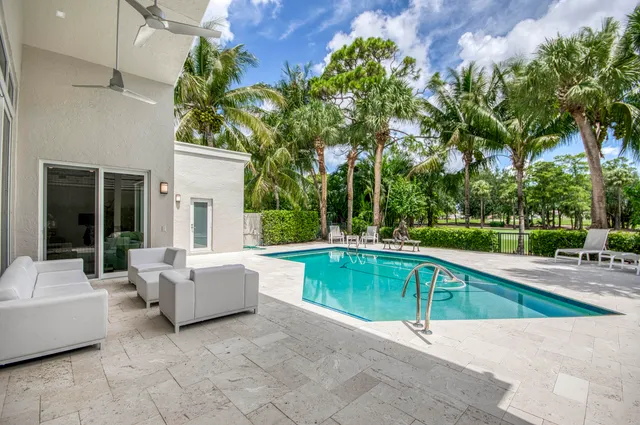 a view of a swimming pool with a patio
