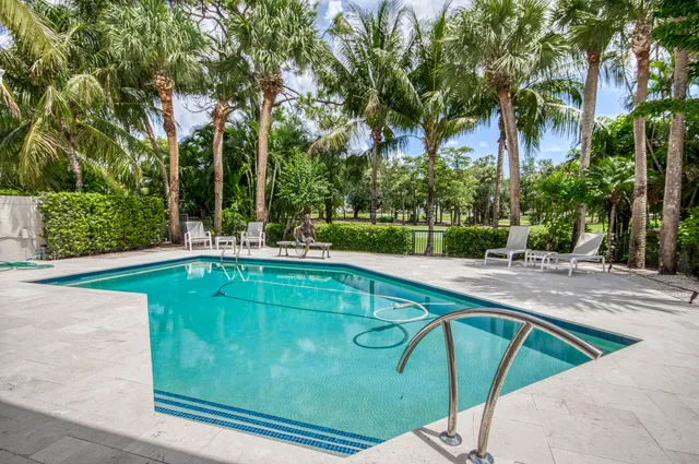 a house view with a sitting space and garden