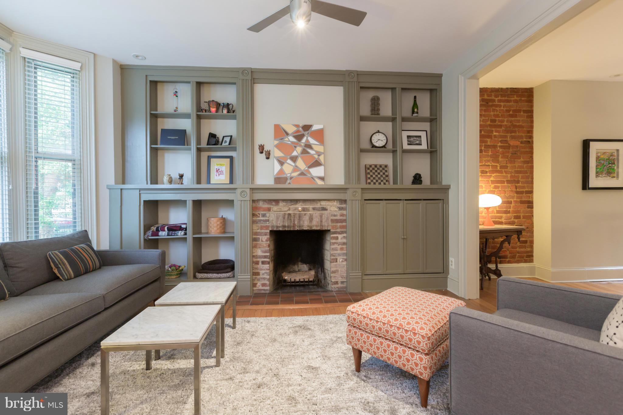 1450 T Street Northwest Washington, DC 20009 - Photo 2 of 14 a living room with furniture and a fireplace