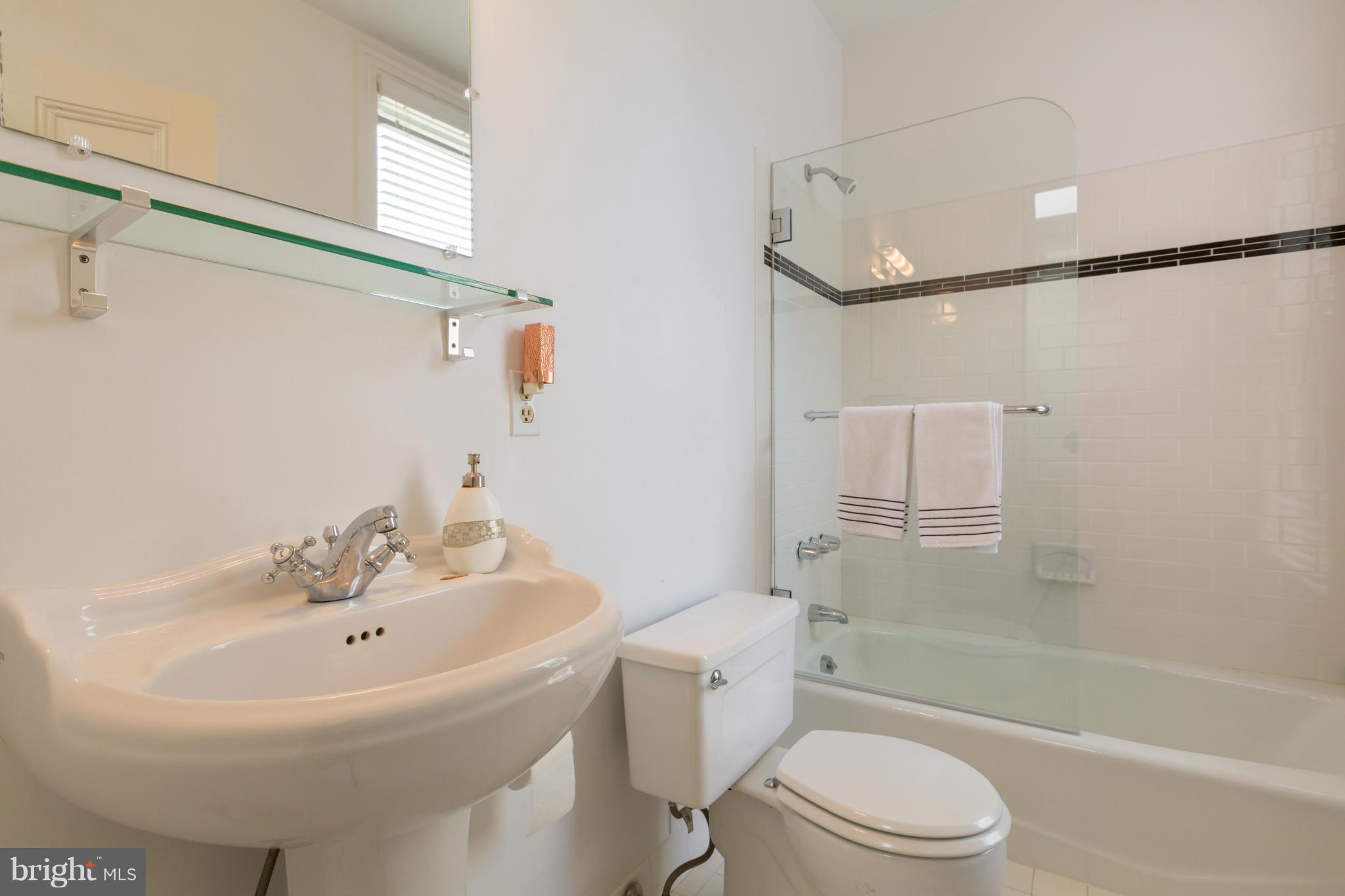1450 T Street Northwest Washington, DC 20009 - Photo 12 of 14 a bathroom with a sink toilet and shower
