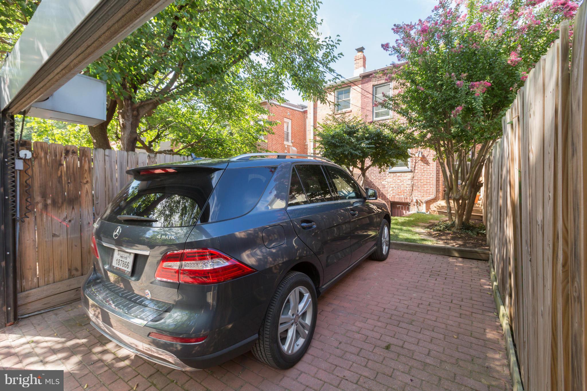 1450 T Street Northwest Washington, DC 20009 - Photo 14 of 14 a car parked in front of a house