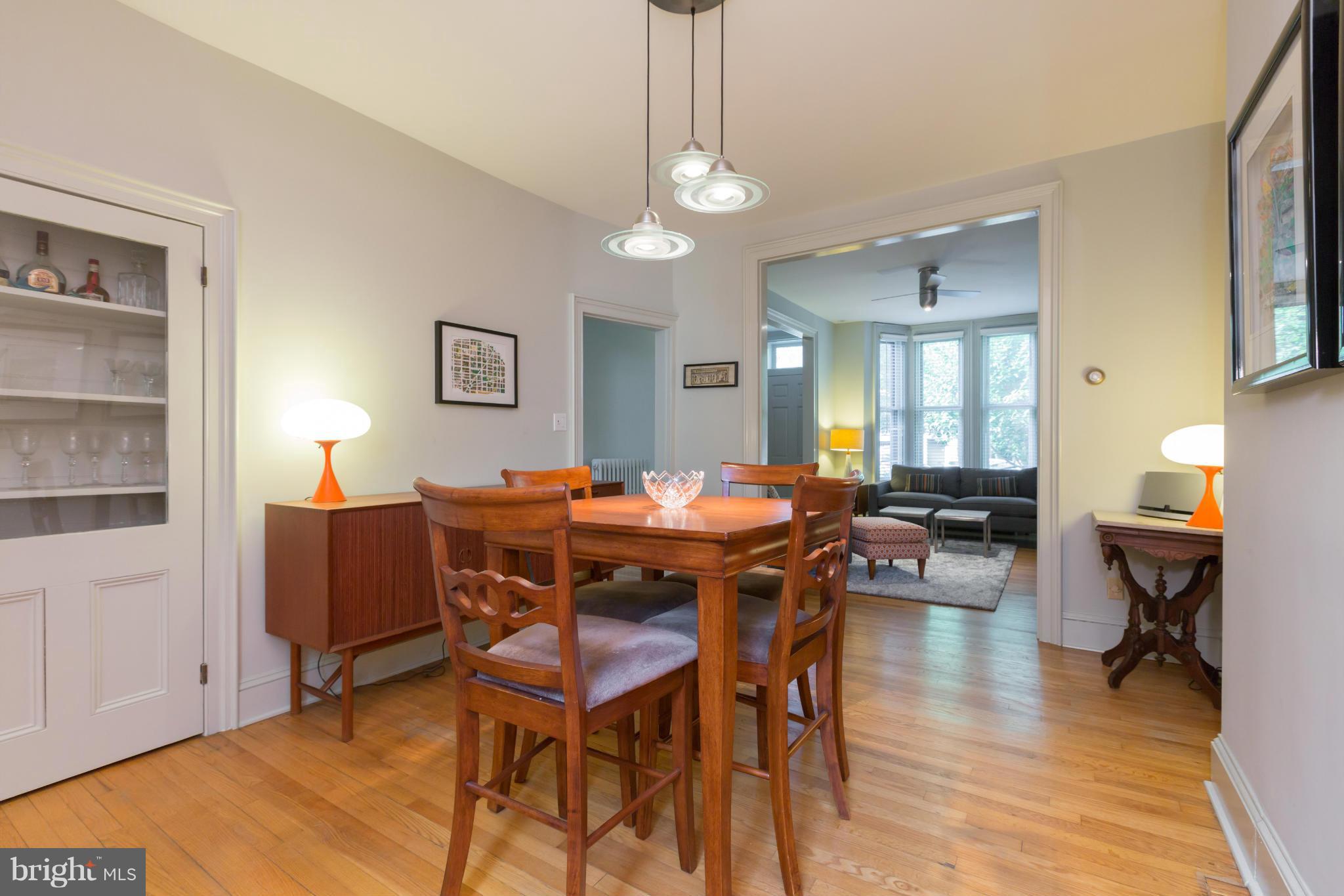 1450 T Street Northwest Washington, DC 20009 - Photo 4 of 14 a view of a dining room with furniture and wooden floor