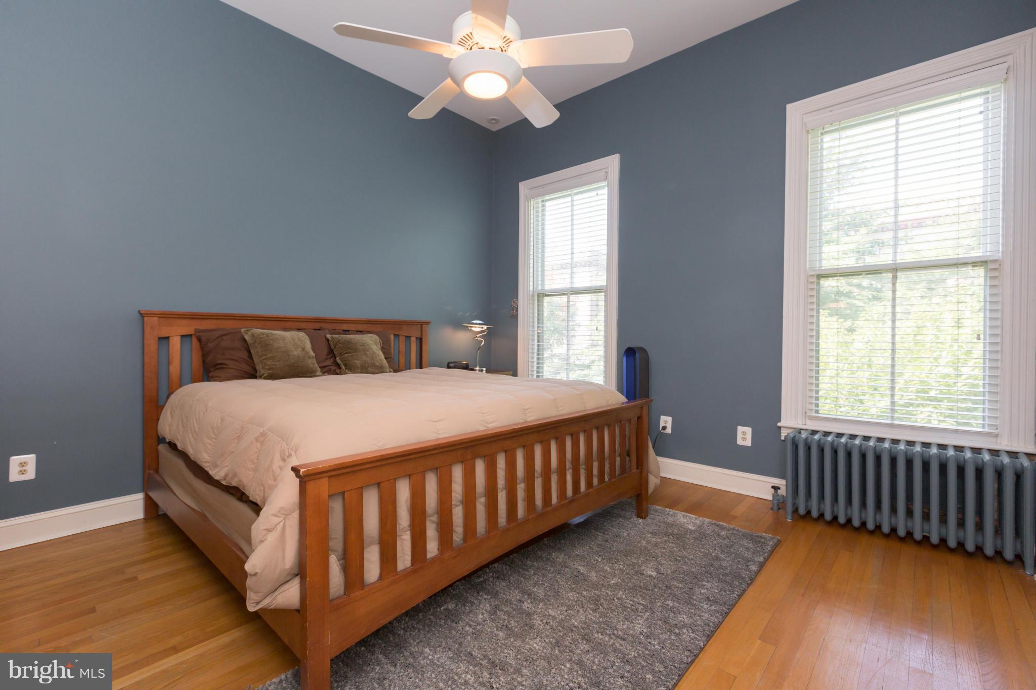 1450 T Street Northwest Washington, DC 20009 - Photo 9 of 14 a bedroom with a bed and a window