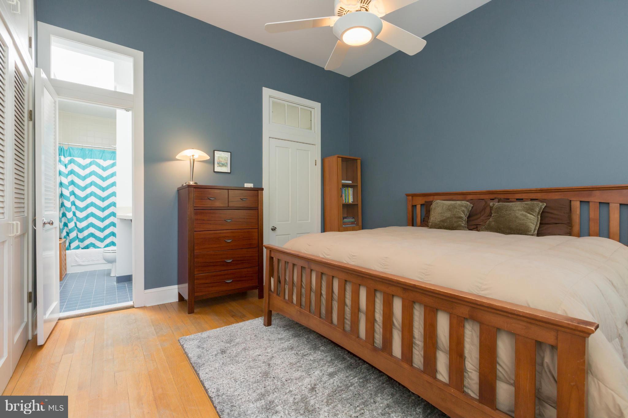 1450 T Street Northwest Washington, DC 20009 - Photo 10 of 14 a bedroom with a bed and wooden floor
