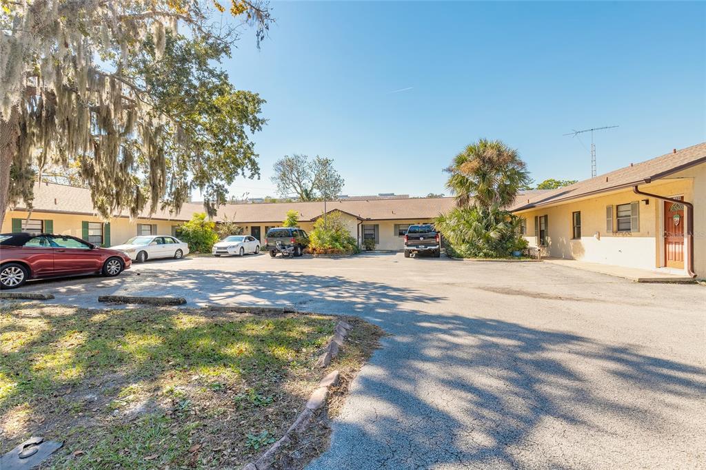 1678 Espanola Avenue Daytona Beach, FL 32117 - Photo 1 of 26 a front view of a house with a yard and a garage