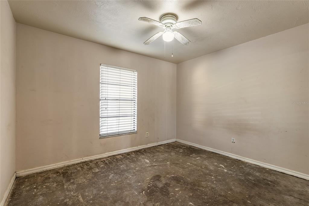 1678 Espanola Avenue Daytona Beach, FL 32117 - Photo 14 of 26 an empty room with a window and a fan