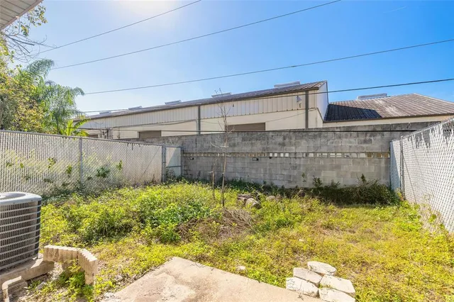 a view of a backyard of the house