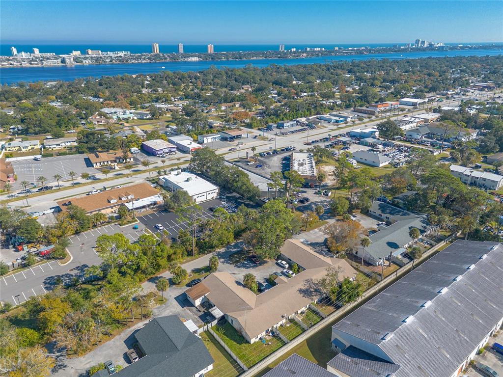 1678 Espanola Avenue Daytona Beach, FL 32117 - Photo 20 of 26 an aerial view of residential building and lake