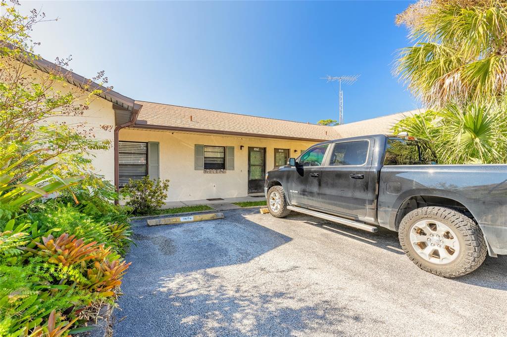 1678 Espanola Avenue Daytona Beach, FL 32117 - Photo 2 of 26 a front view of a house with garden