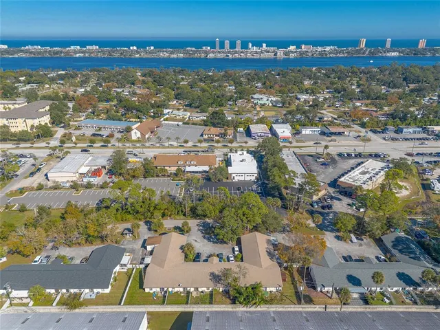 an aerial view of residential building with parking