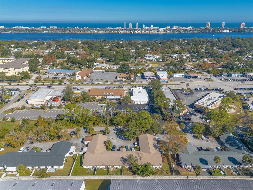 1678 Espanola Avenue Daytona Beach, FL 32117 - Photo 21 of 26 an aerial view of residential building with parking
