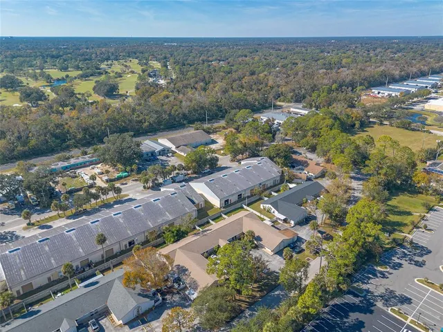 an aerial view of residential building and green space