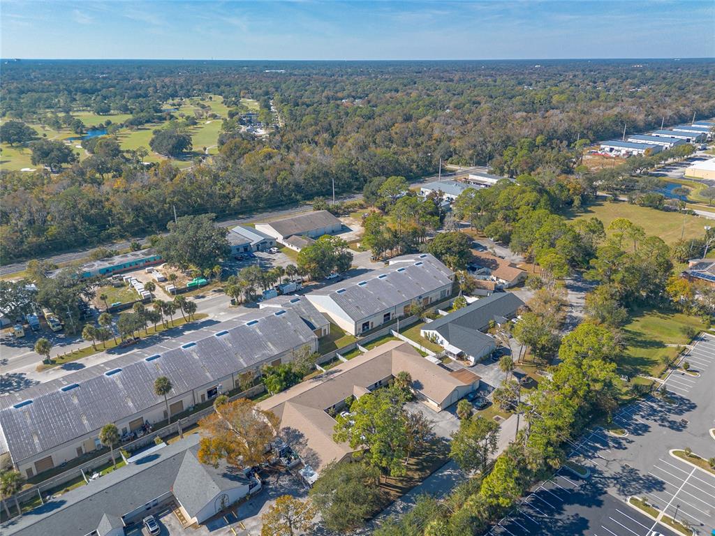 1678 Espanola Avenue Daytona Beach, FL 32117 - Photo 24 of 26 an aerial view of residential building and green space