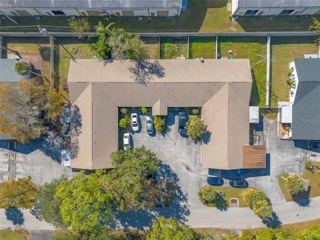 a aerial view of a house with swimming pool