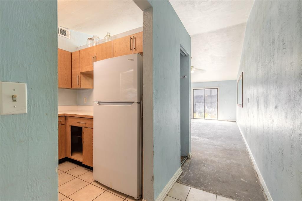 1678 Espanola Avenue Daytona Beach, FL 32117 - Photo 3 of 26 a view of a kitchen with a refrigerator a sink and dishwasher