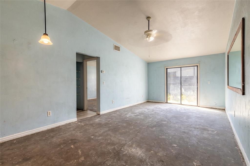 1678 Espanola Avenue Daytona Beach, FL 32117 - Photo 4 of 26 a view of an empty room with a window